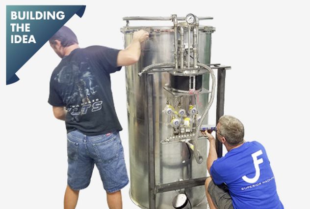 Two men building a next-gen cryotherapy machine prototype